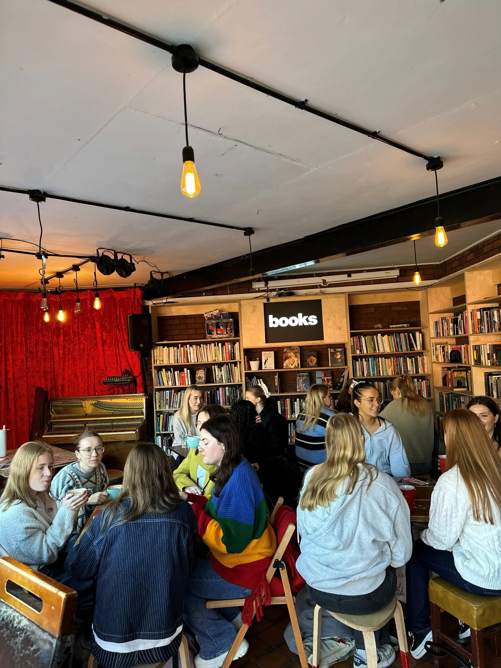 A group sitting together in a bookshop café