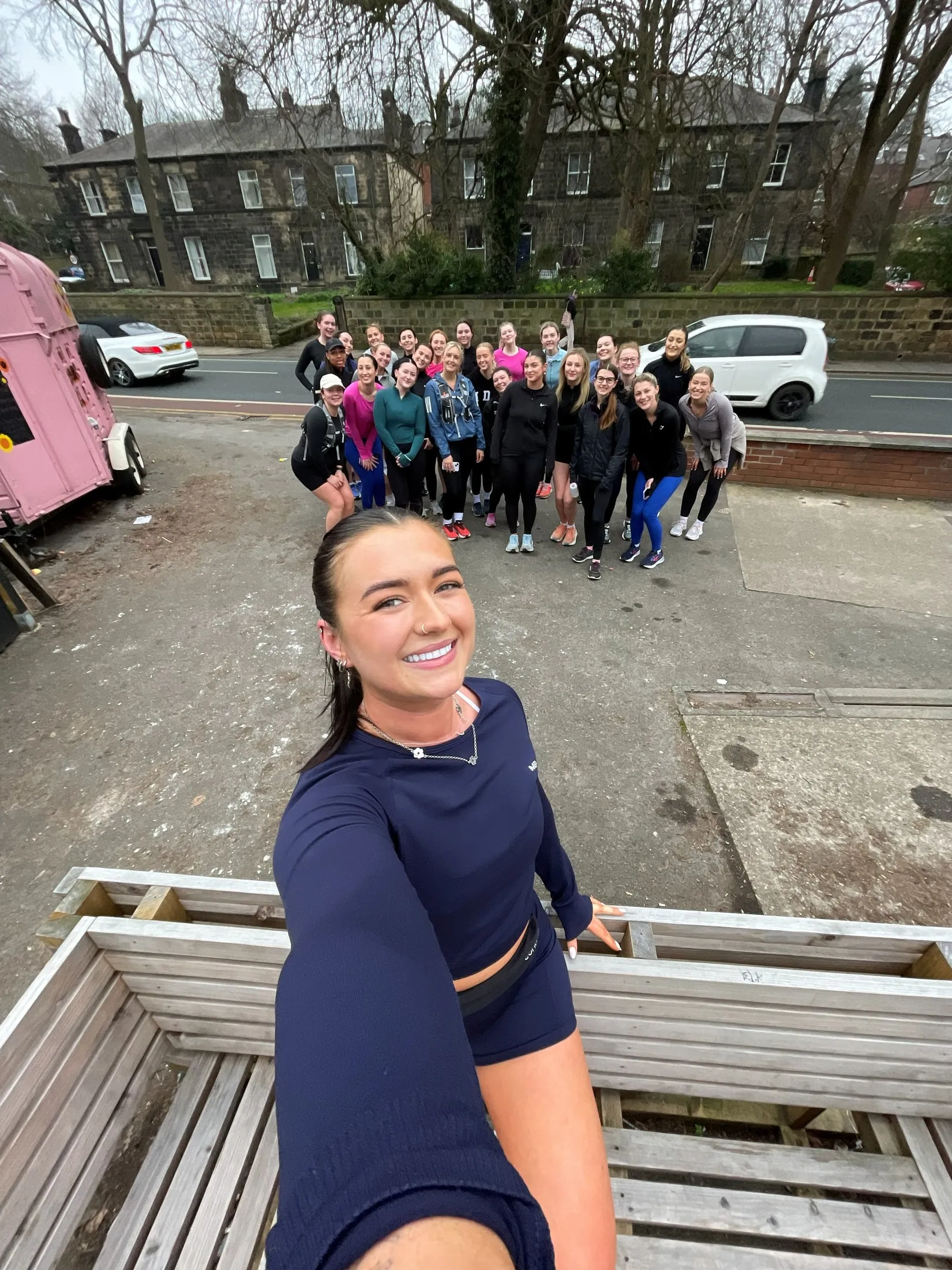 A selfie with a big group of women in sportswear behind