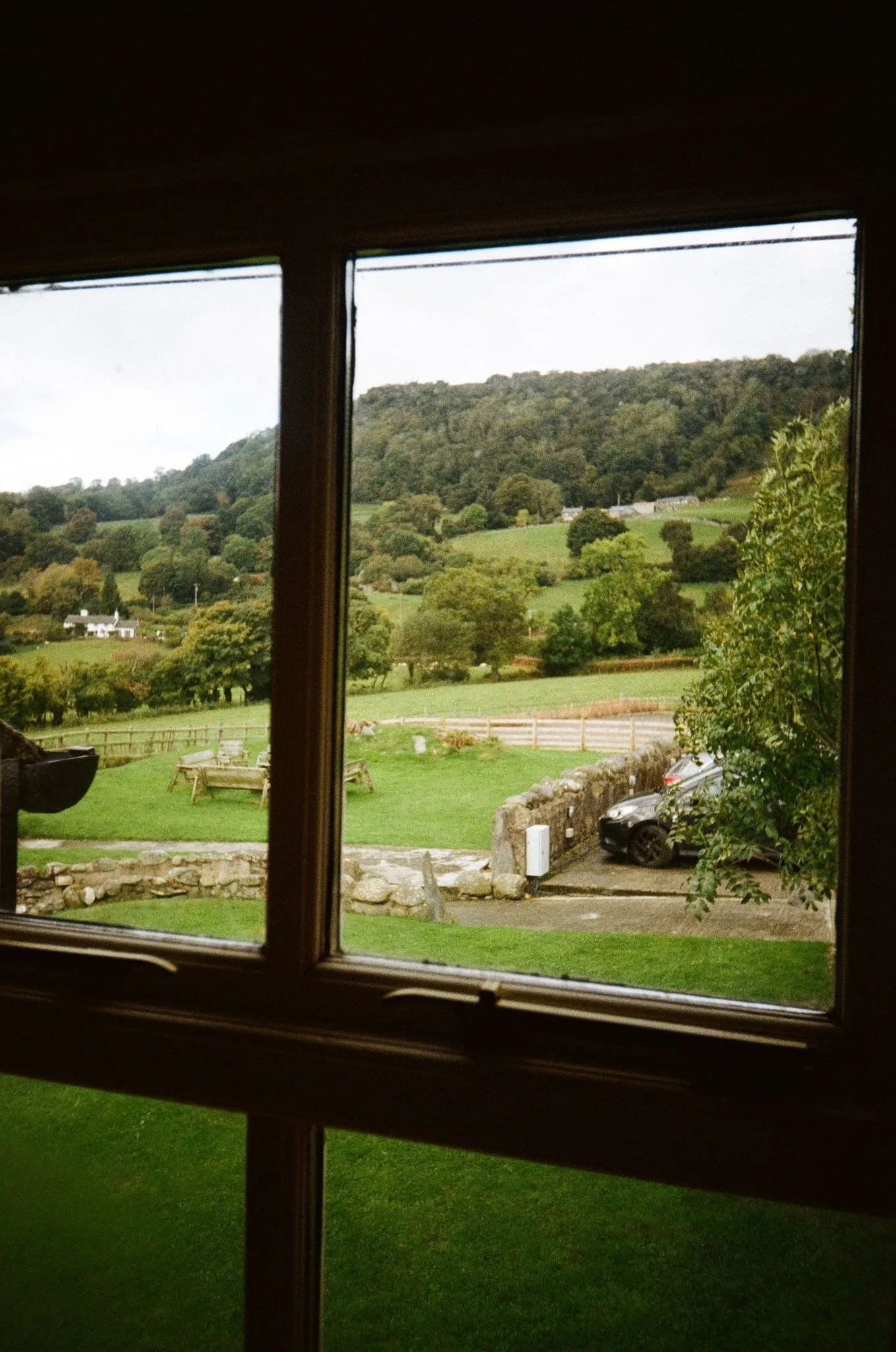 Green hills through a cottage window, shot on film
