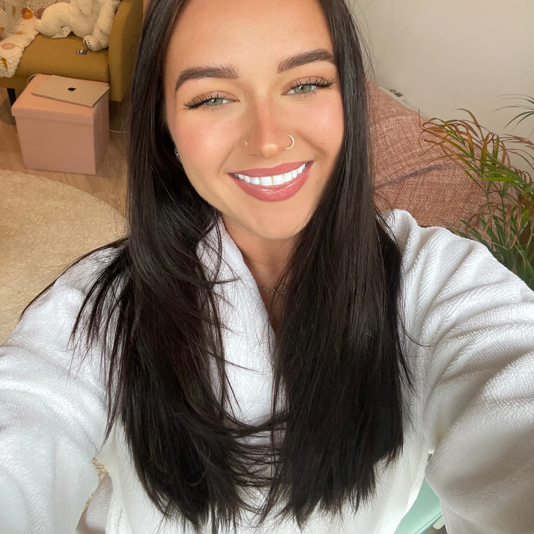 Megan smiling in a white dressing gown